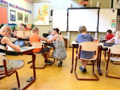 children-sitting-on-brown-chairs-inside-the-classroom-4019754